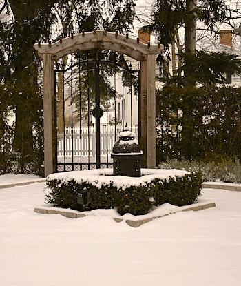 Moroccan iron garden lantern in the snow
